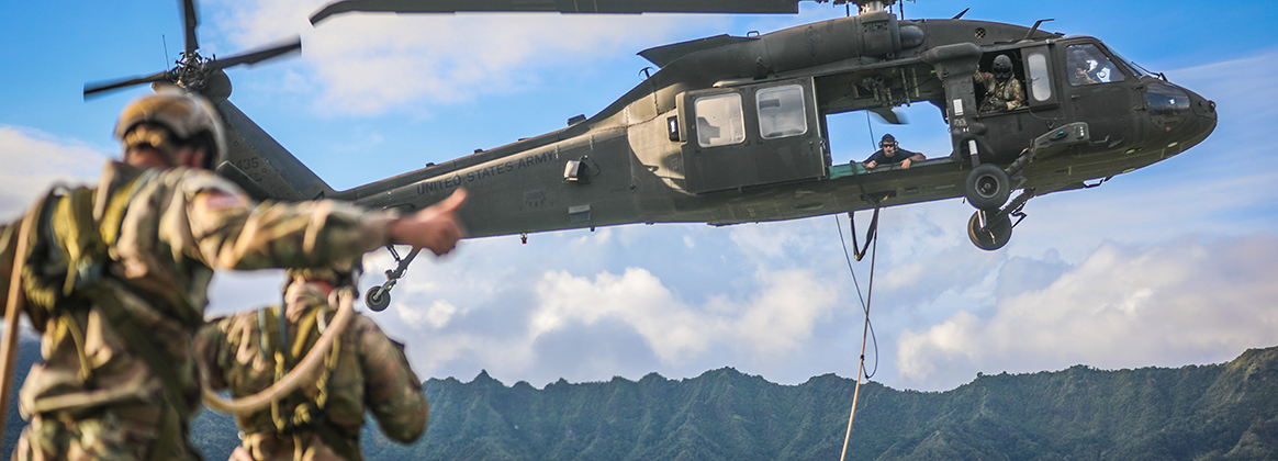 SCHOLFIELD BARRACKS, Hawaii (Nov. 4, 2020)  25th Infantry Division Lightning Academy Air Assault instructors conducted a Rooftop insertion during a Fast Rope Insertion/Extraction System and Special Patrol Insertion/Extraction System (FRIES/SPIES) Master course on Nov. 05, 2020 at Schofield Barracks, Hawaii. Throughout this course, these students were taught how to rig, inspect and deploy Soldiers via a UH-60 by either fast roping 20ft above a rooftop, or suspended 100ft below the helicopter while 200ft above the ground. 
