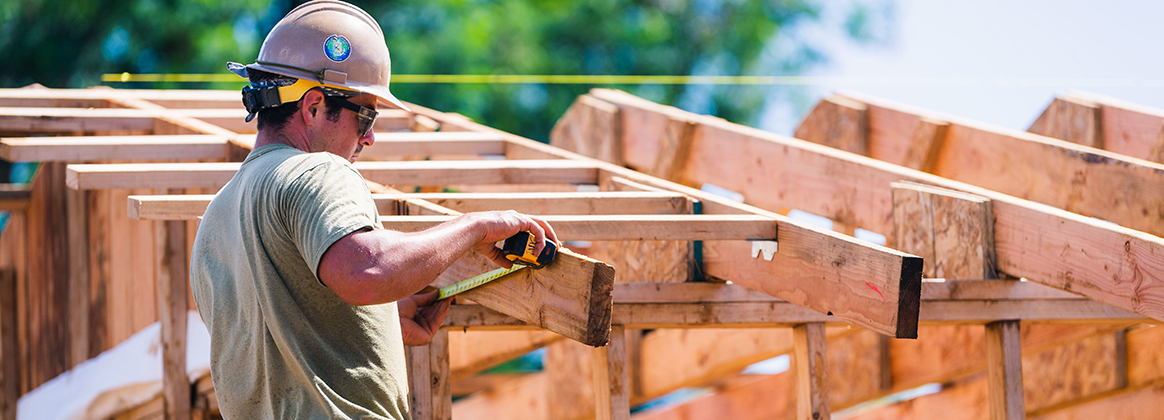 TINIAN, Northern Mariana Islands (Nov. 5, 2020) Builder 3rd Class Matthew Gurrera, from Howell, N.J., deployed with the Seabee expeditionary construction and engineering capability of Task Force 75, marks out trusses for fascia installation in support of Southwest Asia hut construction on Camp Tinian. CTF 75 is 7th Fleet's primary expeditionary task force and is responsible for the planning and execution of maritime security operations, explosive ordnance disposal, diving, engineering and construction, and underwater construction throughout the Indo-Pacific region.
