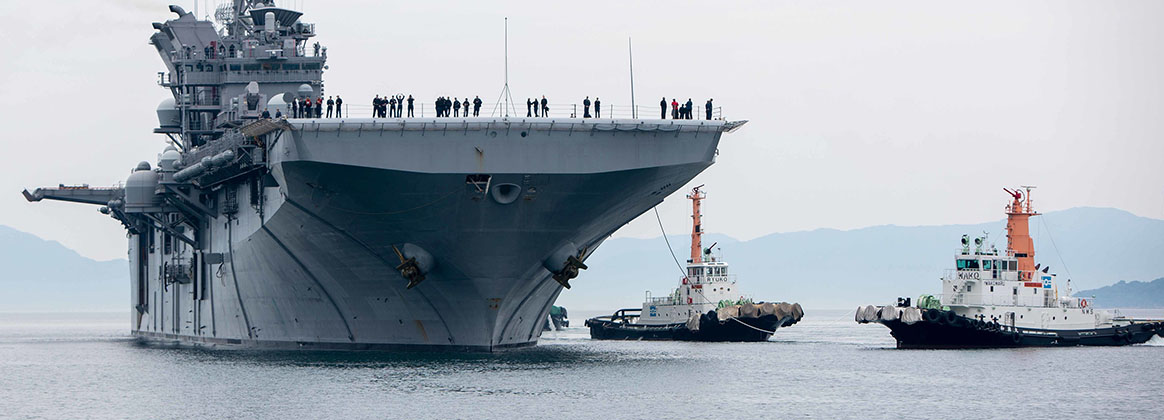 IWAKUNI, Japan (May 20, 2022)  - The amphibious assault ship USS Tripoli (LHA 7) prepares to dock at the Marine Corps Air Station Iwakuni, Japan, harbor May 20, 2022. Due to its geographic location and collocated airfield and harbor, MCAS Iwakuni is uniquely postured to provide advanced naval integration in support of regional security. Tripoli is operating in the U.S. 7th Fleet area of responsibility to enhance interoperability with allies and partners, and serves as a ready response force to defend peace and stability in the Indo-Pacific region. 
