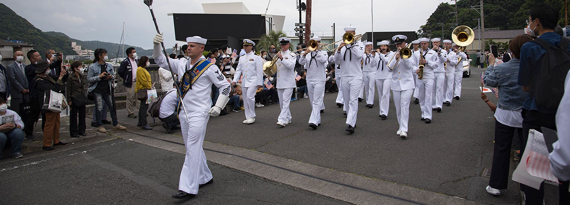 SHIMODA, Japan (May 21, 2022) - The U.S. Seventh Fleet Band marches during a parade for the 83rd annual Shimoda Black Ship festival. The Shimoda Black Ship festival, or Shimoda Kurofune, celebrates Commodore Matthew C. Perry's arrival to Japan, Japan's subsequent opening to international trade, and the U.S.-Japan alliance. For 75 years, CFAY has provided, maintained, and operated base facilities and services in support of the U.S. 7th fleet's forward deployed naval forces, tenant commands, and thousands of military and civilian personnel and their families.
