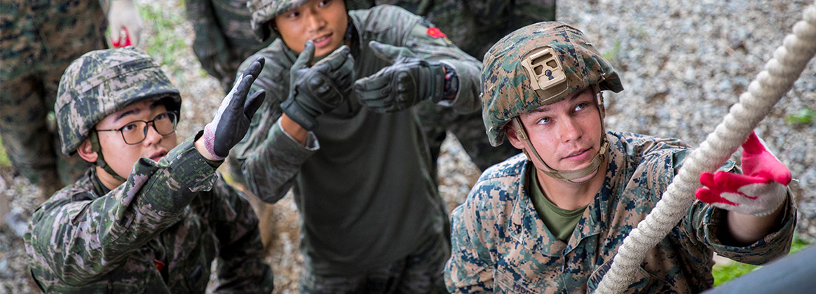 230828-M-JN598-2754 SOUTH KOREA (Aug. 28, 2023) U.S. Marine Corps Lance Cpl. Jayce Moor, a combat engineer with Combat Logistics Company 33, checks the security of a rope while participating in team leadership training during Korean Marine Exchange Program (KMEP) 23 at ROK Marine Corps Base Pohang, South Korea, Aug. 28, 2023. KMEP is a bilateral exercise series focusing on bolstering ROK and U.S. Marine Corps interoperability as a unified, regional littoral force. This exchange facilitated information and strategy sharing, and familiarization with various weaponry and technologies between the allied nations. (U.S. Marine Corps photo by Cpl. Chloe Johnson) 