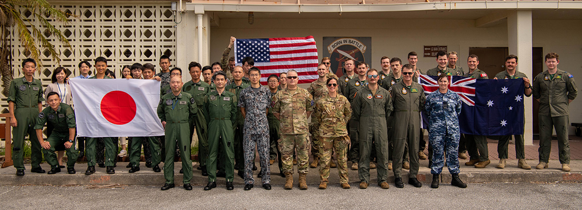230919-F-BS484-1059 KADENA AIR BASE, Japan (Sept. 19, 2023) Flight crews from the Royal Australian Air Force, the Japan Air Self-Defense Force and the U.S. Air Force stand together at Kadena Air Base, Japan, Sep. 19th, 2023. USAF, JASDF and RAAF members refined in-flight communications procedures and established threat warning channels to ensure each nation is ready to provide mutual support during on-going operations in the Pacific. (U.S. Air Force photo by Airman 1st Class Edward Yankus) 