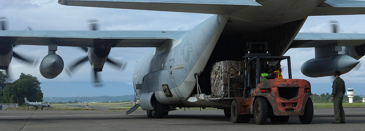 240213-M-MI274-1040 PHILIPPINES (Feb. 13, 2024) U.S. Marines with Marine Aerial Refueler Transport Squadron 152, 1st Marine Aircraft Wing, and Philippine Air Force service members offload pallets of Department of Social Welfare and Development family food packs and humanitarian supplies from a KC-130J Super Hercules aircraft at Davao International Airport, Davao City, Philippines, Feb. 13, 2024. At the request of the Government of the Philippines, the U.S. Marines of III Marine Expeditionary Force are supporting the U.S. Agency for International Development in providing foreign humanitarian assistance to the ongoing disaster relief mission in Mindanao. The forward presence and ready posture of III MEF assets in the region facilitated rapid and effective response to crisis, demonstrating the U.S.’s commitment to Allies and partners during times of need. (U.S. Marine Corps photo by Cpl. Alora Finigan)